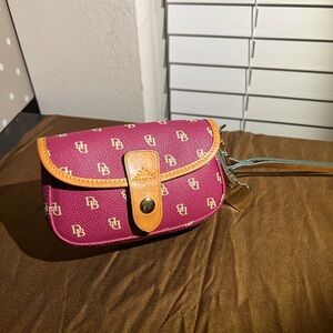Dooney & Burke Raspberry Colored wristlet with tan leather trim-great condition